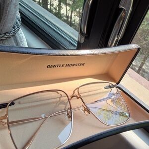 GENTLE MONSTER Gold Frame Sunglasses with Pale Pink Lenses